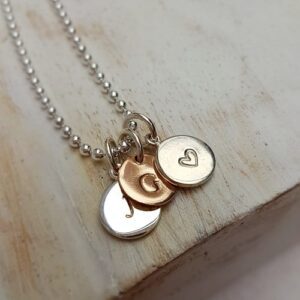hand stamped personalised initial charm sterling silver