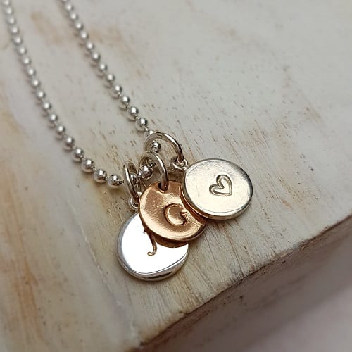 hand stamped personalised initial charm sterling silver