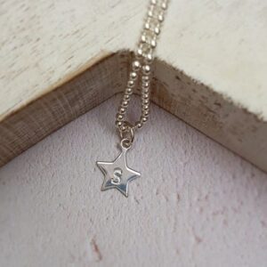 hand stamped sterling silver star charm
