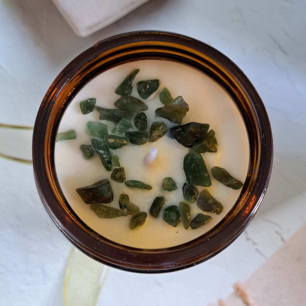 essential oil candle with aventurine crystal chips