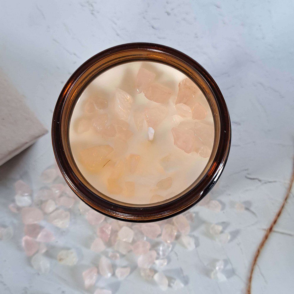 essential oil candle with rose quartz crystal chips