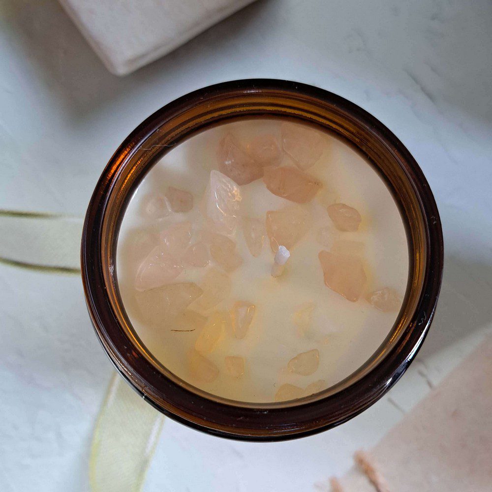 essential oil candle with rose quartz crystal chips